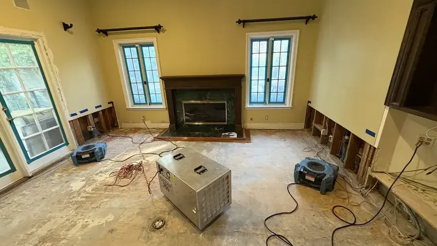 Dehumidifier drying a room with the lower walls cut open